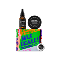 A Lush 'Nice Beard!' Grooming Kit featuring a bright, typographic box in multiple bright colours. The set includes a glass bottle of Dirty hair and beard oil, a tub of Kalamazoo beard and facial wash, and a small tin of Cosmetic Lad moisturiser.