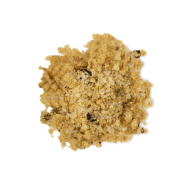 Two Hearts. A neatly poised pile of almost caramel-coloured salt crystals. The bath salt crystals are of varying sizes and textures, piled in a small mound.