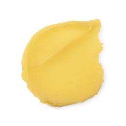 A swatch of thick, rich yellow None Of Your Beeswax lip balm.