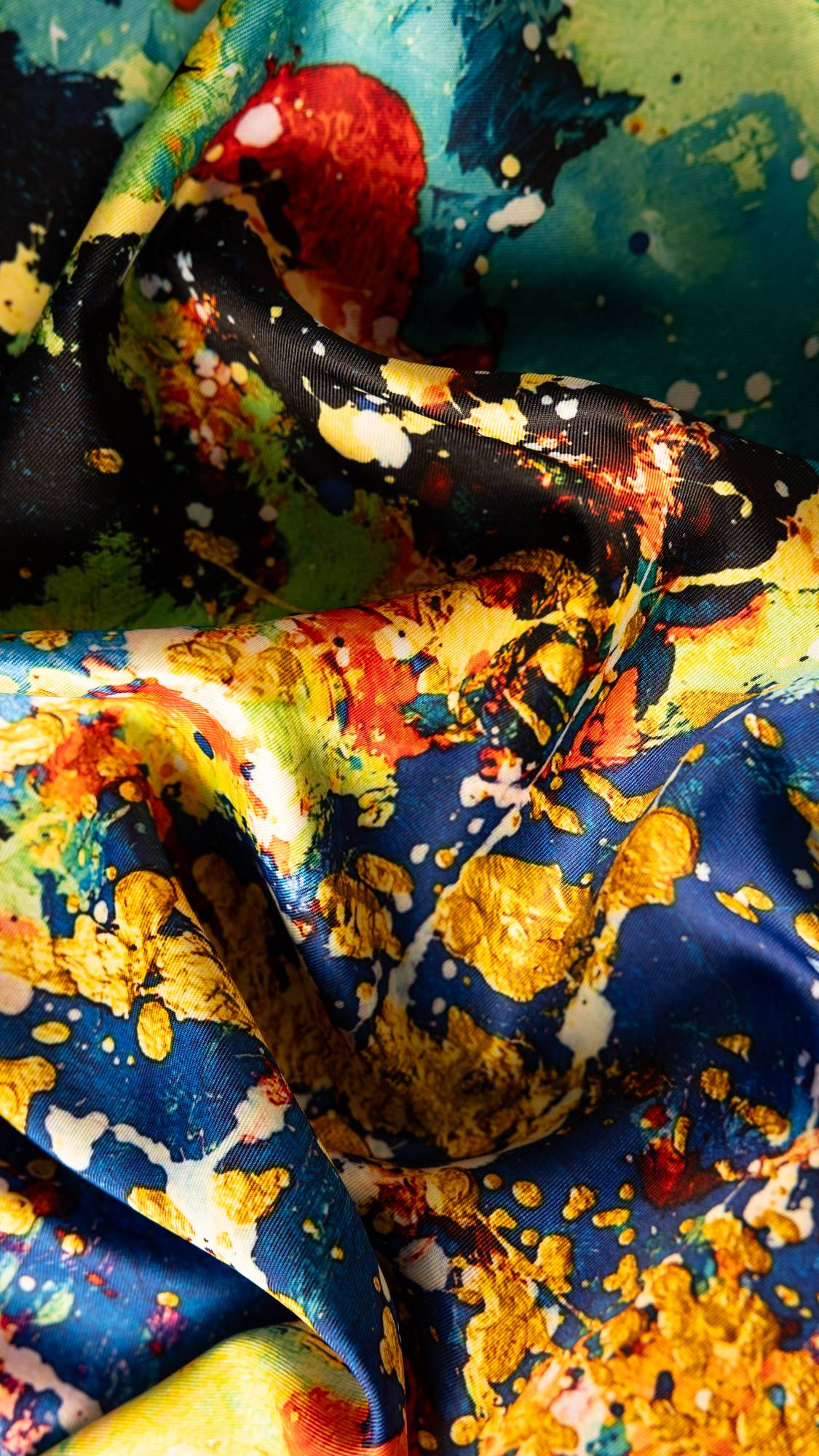 Image shows a super-close up of the Outer Space knot wrap focusing on the explosive, vibrant, contrasting colours.