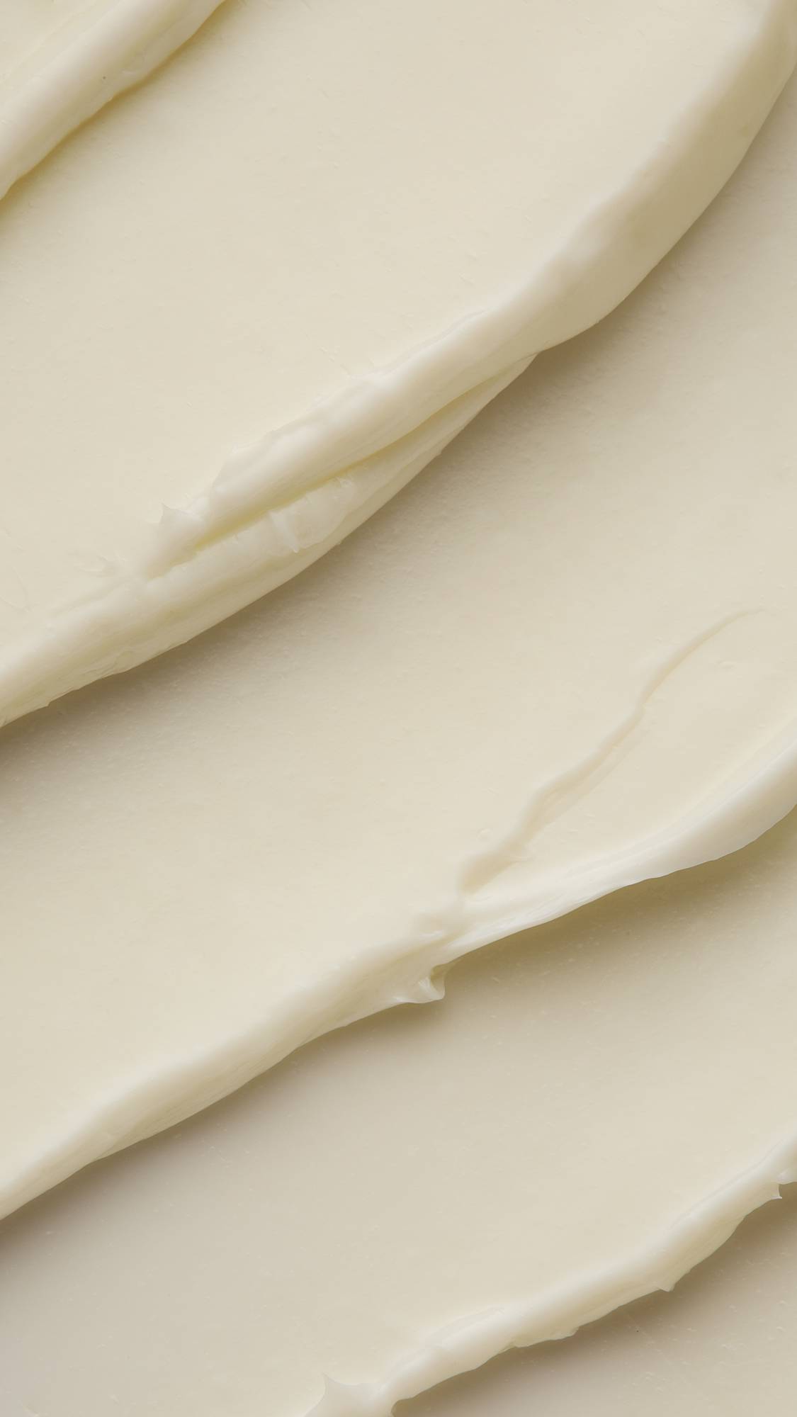 A super close-up of the Peace moisturiser focusing on the almost velvety, fabric-like waves of creamy, satin, lotion.
