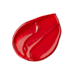 Peach. A neatly smudged swatch of thick, glossy, deep, coral-red lip jelly. 