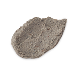 A textured, oval-shaped swatch of thick Lush Persephone's Pomegranate face mask against a white background. The dark greyish-brown paste has a rough texture, filled with numerous tiny exfoliating black specks and small organic fragments.