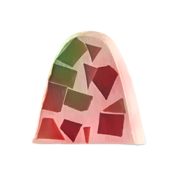 Postrecito. An arch-shaped bar of soap with a pale pink base, embedded with geometric mosaic-like pieces in shades of red, burgundy, and green.