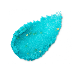 Vibrant turquoise, granular lip scrub smear on a black background. Filled with tiny, shimmering gold star-shaped glitters.