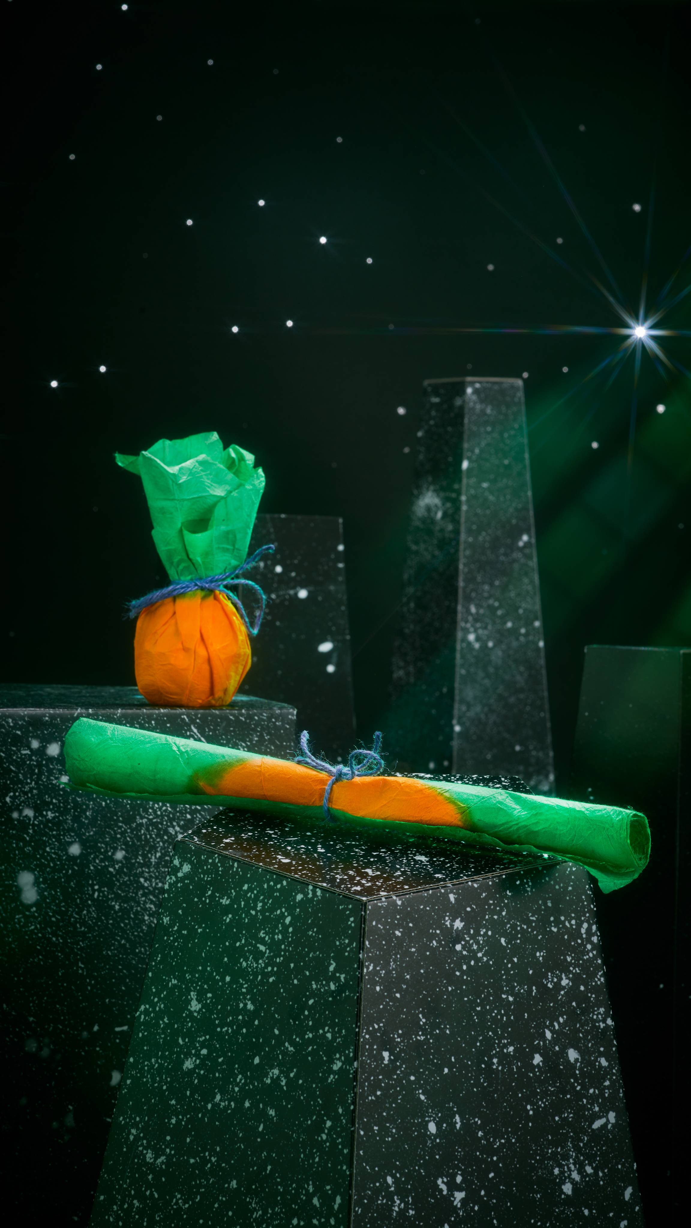 Image shows the Pumpkin Wrap in two ways; one is folded and the other is wrapped around a gift and resembles a pumpkin. 