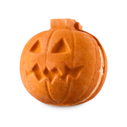 Pumpkin Crumble Bubleroon. A vibrant orange, pumpkin-shaped bubble bar resembling a carved Jack-o'-lantern. It appears segmented, with a visible seam revealing a light creamy interior, and has carved eyes and a jagged mouth.