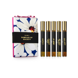 Samples of Society. A daisy print fabric wrapped, rectangular perfume box gift, finished with pink ribbon and a black sleeve.