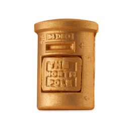Santa's Postbox. A festive, openable, shimmering-golden-coloured bath bomb. It is shaped like a classic, cylindrical British post box with a removable front section. The removable part has "The North Pole" embossed into it. 