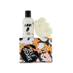 Self Scare. A ghost-patterned box tied with an orange cord sits below a bottle of 'BOO!' shower gel and a white, ghost-shaped bar of soap.