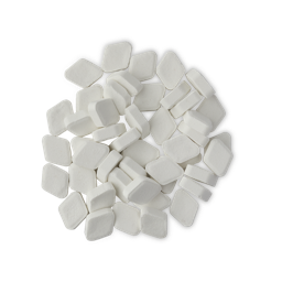 Shimmy Shimmy. A small pile of about three dozen, white, chalky, rounded-diamond-shaped mouthwash tablets. 