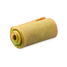 Showstopper. The image shows a cylindrical log of soap, rolled in a spiral. Its outer layers are a caramel colour with golden lustre, revealing lighter green inner layers in a distinct spiral pattern.