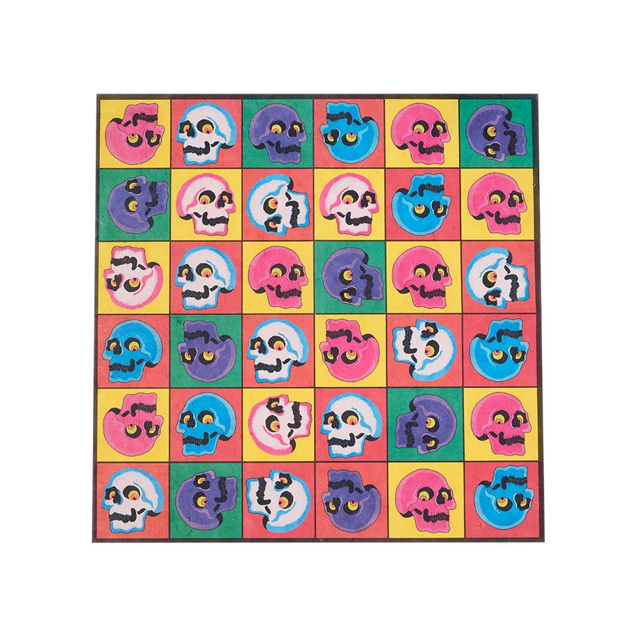 Skullywood. The image shows a square, multicoloured sheet of lokta paper with a grid pattern. Each square contains a cartoonish skull in various colours, all in a Pop Art style, against a background of bright pink, green, and yellow.