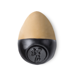 Slap Stick 18C. A medium light-cool, tan coloured, egg-shaped solid foundation, with a black wax base.