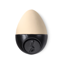 Slap Stick 1C. A light-cool, cream coloured, egg-shaped solid foundation, with a black wax base.