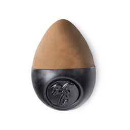 Slap Stick 28C. A medium dark-cool, light chocolate brown, egg-shaped solid foundation, with a black wax base.
