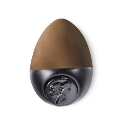 Slap Stick 32C. A dark-cool, chocolate brown, egg-shaped solid foundation, with a black wax base.