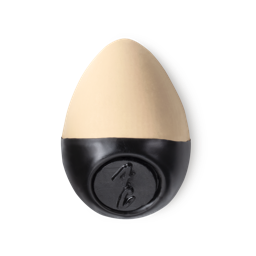 Slap Stick 4C. A light-cool, light beige coloured, egg-shaped solid foundation, with a black wax base.