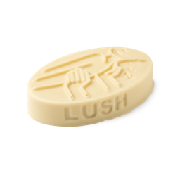 Sleep. A cream coloured, oval shaped, solid massage bar, with an embossed design of a person being massaged to sleep.