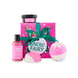 Snow Fairy. A square git box wrapped in colourful, pink paper with white snowflakes and flowing patterns, tied with a green ribbon and a white gift tag. Four Snow Fairy-themed products sit on and around the box.