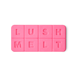 A solid, vibrant pink bath melt with "LUSH" embossed on the top four squares and "MELT" on the bottom four, creating a tactile, alphabet-block-like appearance.