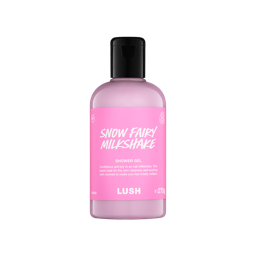 A clear bottle filled with opaque, creamy pink Lush Snow Fairy Milkshake shower gel, topped with a black cap and featuring a bright pink label
