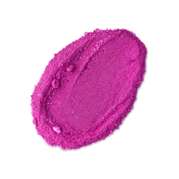 A smear of vibrant, crystalline magenta Snow Fairy Pop shower powder. The powder has a grainy, shimmering texture.