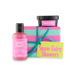 Snow Fairy Showers. An off-square gift box wrapped in striped pink and blue paper, tied with a teal ribbon and attached yellow gift tag. Two Snow Fairy shower products sit around the gift box.