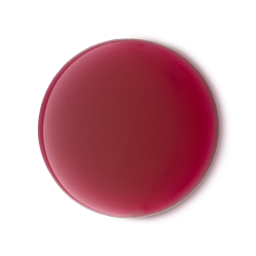 A circular dollop of vibrant red Sorcery shower gel centered on a solid black background. The gel has a smooth, glossy texture and a rich, deep color.