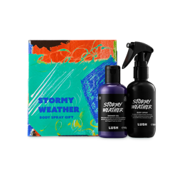 Stormy Weather. A colourful abstract box in teal, orange, and blue. Beside it stands a bottle of purple "Stormy Weather" shower gel and a black bottle of body spray of the same name. Both items feature white text on black labels.