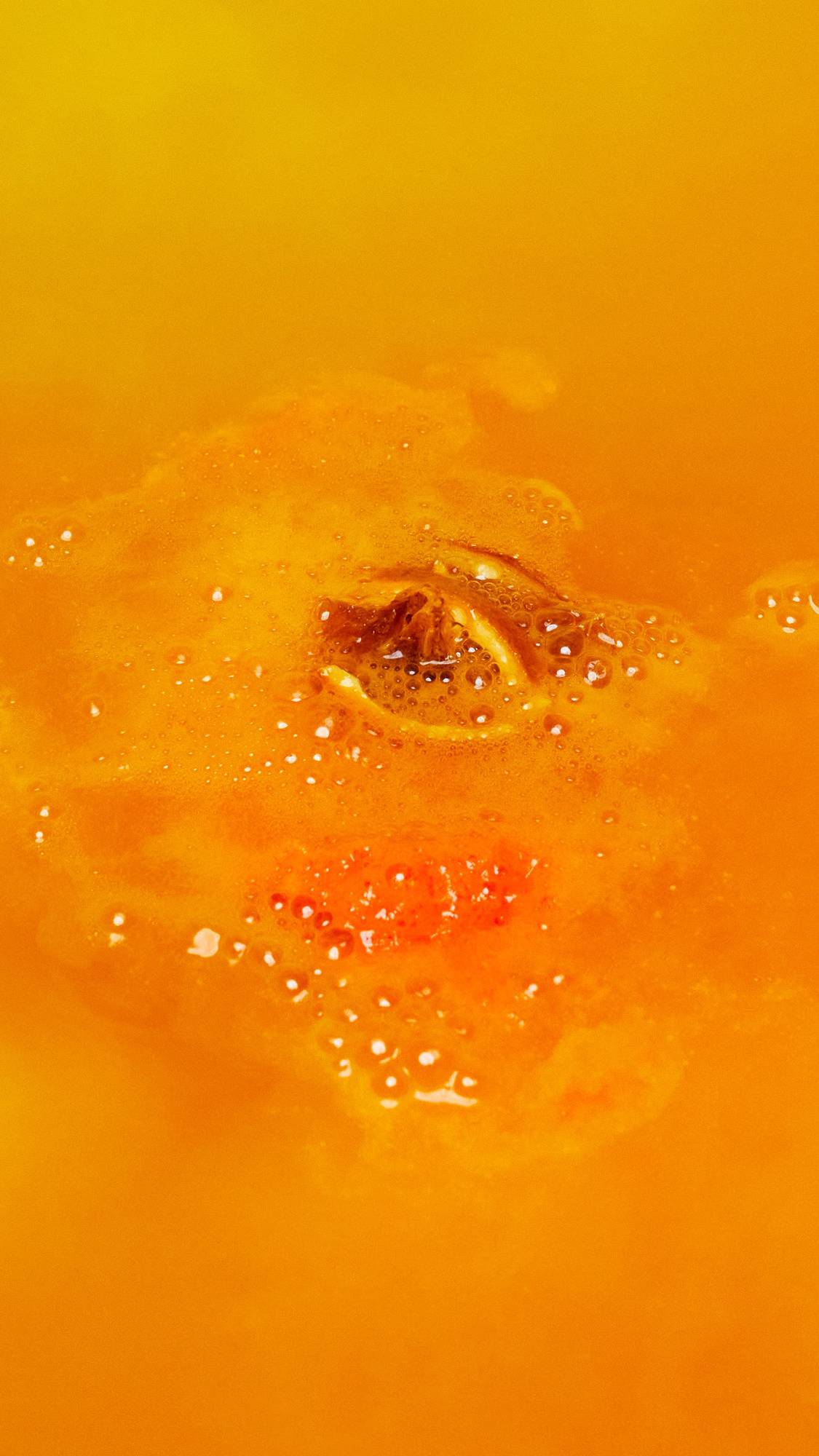 The One With The Orange Slices has completely dissolved leaving behind deep, amber-coloured water and a handful of dried orange slices floating on the surface. 