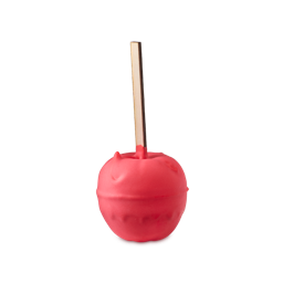 Toffee Apple. A whimsical bath bomb shaped like a bright red candy apple on a thick wooden stick, coated in a smooth, matte red layer.