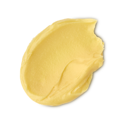 Turmeric And Argan. A neatly smudged swatch of creamy, soft, buttery-yellow facial cleanser. 