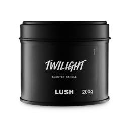 Twilight. A round, black, candle tin with a removable lid. The black label on the front reads "Twilight Scented Candle" in white text.