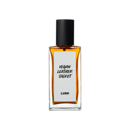 Vegan Leather Jacket. A rectangular, glass perfume bottle with a black cap is filled with translucent, amber liquid. A white label reads 'Vegan Leather Jacket'.