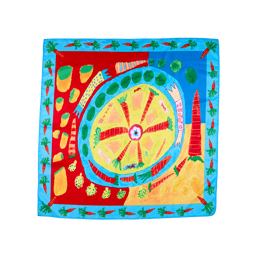 Veggie Christmas Dinner. A square, fabric knot wrap with a blue, carrot-filled border. The centre depicts an illustrated image of a dinner plate with vegetables. It is surrounded by crackers and vegetables on prime colours.