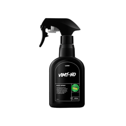 A black, curvy spray bottle of VIMT-NO Body Spray with a black trigger nozzle, centered on a black background. The label is black with white text detailing the product name and description, and it features a bright green "LUSH CLUB" sticker.