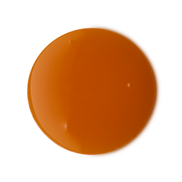 Wash Behind Your Ears. A perfectly circular swatch of smooth, glossy, deep orange shower gel.