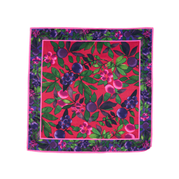 Winter Berries. A square, fabric knot wrap with a colorful, festive design with a red base and green leaves, purple berries, and pink flowers. There is a decorative border with a purple base and the same festive design.
